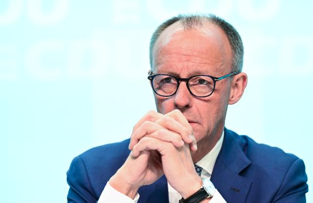 17 May 2025, Baden-Württemberg, Stuttgart: German Chancellor Friedrich Merz sits at the podium at the state party conference of the Christian Democratic Union of Germany (CDU) Baden-Wuerttemberg. Photo: Bernd Weißbrod/dpa