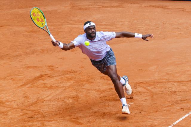 21 May 2025, Hamburg: US tennis player Frances Tiafoe in action against Spain's Roberto Bautista Agut during their men's singles round of 16 tennis match of the Hamburg European Open. Photo: Frank Molter/dpa