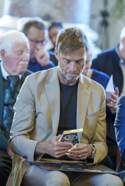 22 May 2025, Hesse, Wiesbaden: Global Head of Soccer at Red Bull Juergen Klopp watches a speech about his farewell as coach at Liverpool FC during the award ceremony. The coaching legend was presented with the special "Fair Play Prize of German Sport 2024" award. Photo: Andreas Arnold/dpa