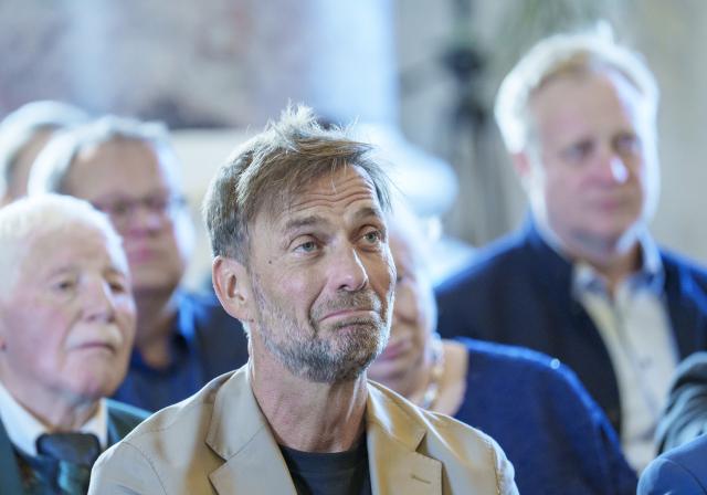 22 May 2025, Hesse, Wiesbaden: Global Head of Soccer at Red Bull Juergen Klopp watches a speech about his farewell as coach at Liverpool FC during the award ceremony. The coaching legend was presented with the special "Fair Play Prize of German Sport 2024" award. Photo: Andreas Arnold/dpa