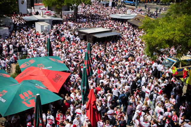 24 May 2025, Berlin: Stuttgart fans gather on Breitscheidplatz ahead of the DFB Cup final match soccer match against Arminia Bielefeld. Photo: Christoph Soeder/dpa