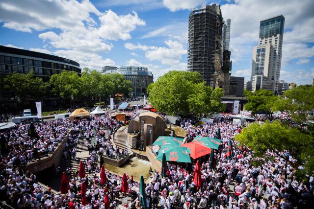 24 May 2025, Berlin: Stuttgart fans gather on Breitscheidplatz ahead of the DFB Cup final match soccer match against Arminia Bielefeld. Photo: Christoph Soeder/dpa
