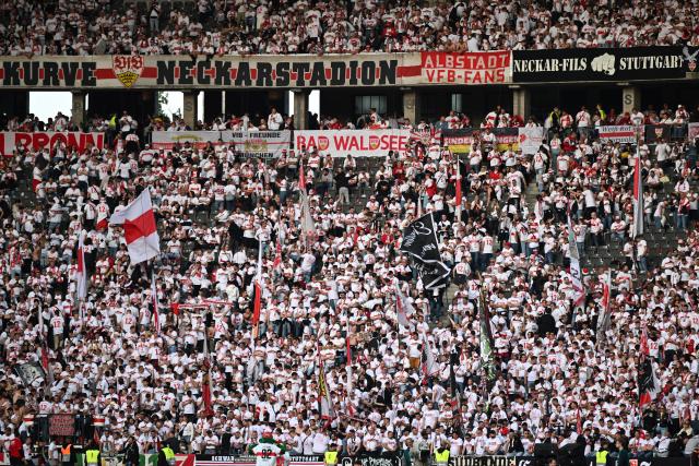 24 May 2025, Berlin: Stuttgart fans cheer in the stands before the start of the German DFB Cup final soccer match between Arminia Bielefeld and VfB Stuttgart at the Olympiastadion. Photo: Federico Gambarini/dpa