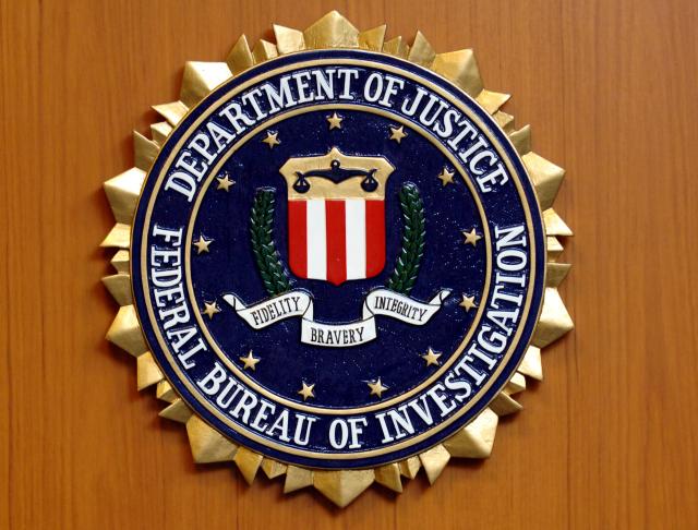 FILED - 05 September 2005, Berlin: The coat of arms of the Federal Bureau of Investigation (FBI) of the US Department of Justice hangs in the US Embassy in Berlin. FBI intends to release documents regarding the death of the notorious sex offender Jeffrey Epstein. Photo: Tim Brakemeier/dpa