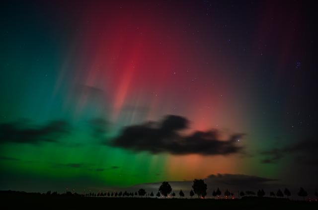 FILED - 10 October 2024, Brandenburg, Lietzen: Northern lights shine in the night sky over the landscape in eastern Brandenburg. Stargazers in Germany may be treated to a sky lit up by the Northern Lights on Sunday night. Photo: Patrick Pleul/dpa