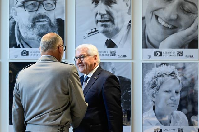 03 June 2025, Berlin: German President Frank-Walter Steinmeier greets a veteran during a visit to the Bundeswehr Veterans' Office in Berlin to mark the first National Veterans' Day. Photo: John Macdougall/AFP-Pool/dpa