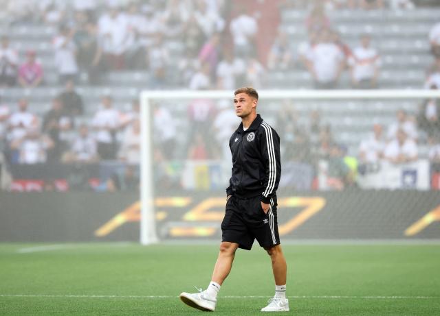 04 June 2025, Bavaria, Munich: Germany's Joshua Kimmich inspects the pitch ahead of the UEFA Nations League semi final soccer match between Germany and Portugal at Allianz Arena. Photo: Christian Charisius/dpa