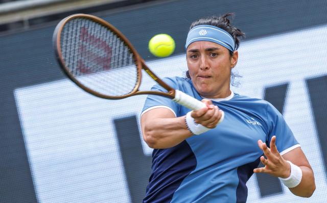 16 June 2025, Berlin: Tunisian tennis player Ons Jabeur in action against US Caroline Dolehide during their women's singles first round match of the Berlin Open tennis tournament at Steffi Graf Stadium. Photo: Andreas Gora/dpa