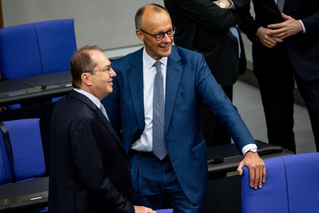 27 June 2025, Berlin: Alexander Dobrindt (L), German Minister of the Interior, and German Chancellor Friedrich Merz take part in a session of the Bundestag. Topics of the session include a vote on the suspension of family reunification and the first reading of a bill to amend the naturalization law. Photo: Fabian Sommer/dpa
