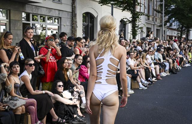 30 June 2025, Berlin: Models show creations from designer Clara Colette Miramon's "care" collection for spring/summer 2026 on Rosa-Luxemburg sreet, as part of Berlin Fashion Week. Photo: Jens Kalaene/dpa
