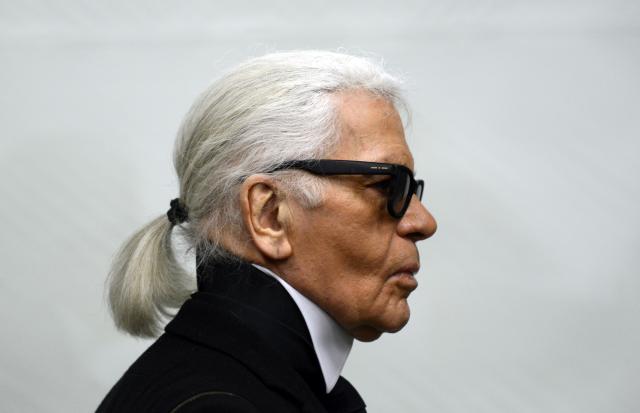 FILED - 14 February 2014, North Rhine-Westphalia, Essen: Fashion designer Karl Lagerfeld goes through an exhibition at the Museum Folkwang. Lagerfeld, who died in 2019, is scheduled to be auctioned on 01 July. Photo: Caroline Seidel/dpa