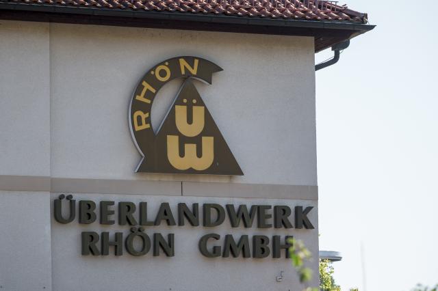 01 July 2025, Bavaria, Mellrichstadt: The company logo of the regional grid operator Überlandwerk Rhoen. A 21-year-old killed a colleague at the company and seriously injured two others. Photo: Daniel Vogl/dpa