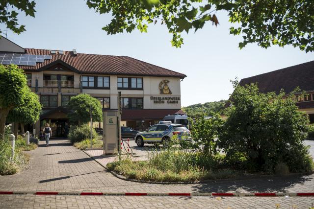 01 July 2025, Bavaria, Mellrichstadt: Police and emergency services are on the premises of the regional network operator Überlandwerk Rhön. A 21-year-old killed a colleague at the company and seriously injured two others. Photo: Daniel Vogl/dpa