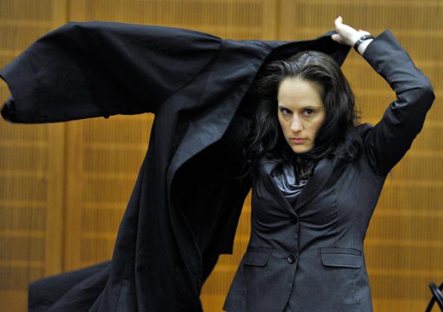 FILED - 09 January 2012, Hesse, Frankfurt am Main: Michaela Roth, lawyer of the 'airport assasin' Arid Uka, puts on her robe at the regional appeal court in Frankfurt Main. Men continue to dominate the top positions in Germany's leading law firms, with women accounting for just 16% of partners as of early April, according to a new report by the Allbright Foundation released on Tuesday. Photo: picture alliance / dpa