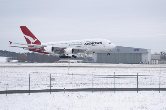 FILED - 14 January 2025, Saxony, Dresden: A Qantas Airways Airbus A380 lands at Dresden Airport. The aircraft belonging to the Australian airline Qantas has come to Elbe Flugzeugwerke (EFW) for maintenance work. Cybercriminals have gained access to data belonging to up to 6 million Qantas customers, the Australian airline confirmed on Wednesday, adding that the system has since been contained. Photo: Sebastian Kahnert/dpa
