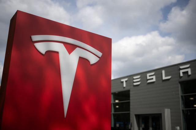 FILED - 23 April 2024, Berlin: The Tesla logo is seen at a car dealership. Tesla reported a significant drop in global car deliveries in the second quarter, falling 13.5% year-on-year to 384,122 vehicles, the company announced on Wednesday. Photo: Sebastian Gollnow/dpa