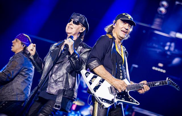 05 July 2025, Lower Saxony, Hanover: (L-R) Pawel Maciwoda, Klaus Meine and Matthias Jabs from the rock band Scorpions perform on stage during their concert in the Heinz-von-Heiden-Arena. The Scorpions celebrate the 60th anniversary of their band with a sold-out stadium concert in their hometown of Hanover. Photo: Moritz Frankenberg/dpa