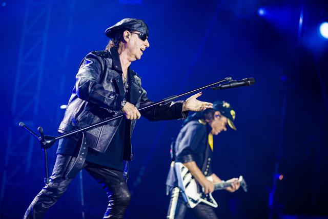 05 July 2025, Lower Saxony, Hanover: Klaus Meine (L) and Matthias Jabs from the rock band Scorpions perform on stage during their concert in the Heinz-von-Heiden-Arena. The Scorpions celebrate the 60th anniversary of their band with a sold-out stadium concert in their hometown of Hanover. Photo: Moritz Frankenberg/dpa