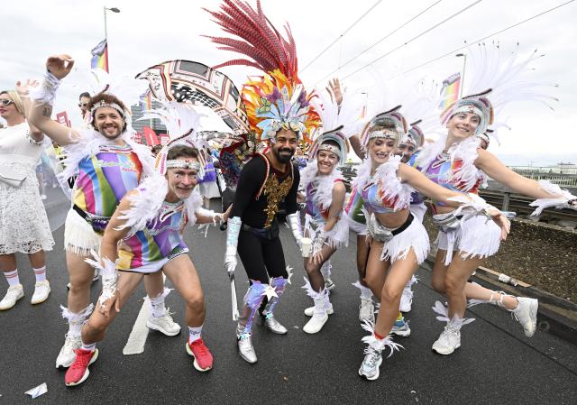 06 July 2025, North Rhine-Westphalia, Cologne: Participants in the Christopher Street Day (CSD) parade in colorful outfits celebrate their protest in the streets of the city for better rights for the LGBTQ community. Photo: Roberto Pfeil/dpa