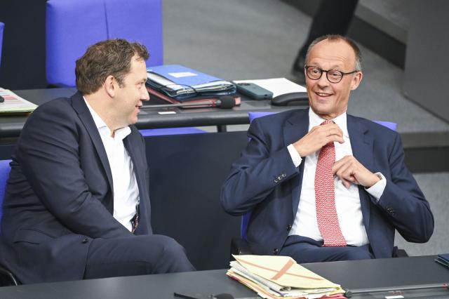 09 July 2025, Berlin: German Chancellor Friedrich Merz (R) talks to Lars Klingbeil, German Minister of Finance, Vice-Chancellor, before the general debate on the budget in the plenary session of the Bundestag. The general debate is the highlight of the budget week in the Bundestag. Photo: Katharina Kausche/dpa