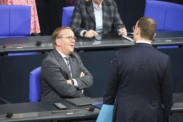 09 July 2025, Berlin: Boris Pistorius (L), German Minister of Defense, speaks with Jens Spahn, CDU/CSU parliamentary group leader in the Bundestag, before the general debate on the budget in the plenary session of the Bundestag. The general debate is the highlight of the budget week in the Bundestag. Photo: Katharina Kausche/dpa