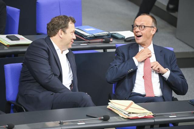 09 July 2025, Berlin: German Chancellor Friedrich Merz (R) talks to Lars Klingbeil, German Minister of Finance, Vice-Chancellor and SPD Federal Chairman, before the general debate on the budget in the plenary session of the Bundestag. The general debate is the highlight of the budget week in the Bundestag. Photo: Katharina Kausche/dpa