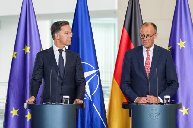 09 July 2025, Berlin: German Chancellor Friedrich Merz (R) and NATO Secretary General Mark Rutte speak during a press conference in the Chancellery after their meeting. Photo: Soeren Stache/dpa
