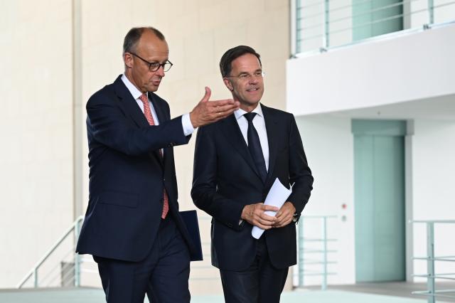 09 July 2025, Berlin: German Chancellor Friedrich Merz (L) and NATO Secretary General Mark Rutte arrive for a press conference in the Chancellery after their meeting. Photo: Niklas Treppner/dpa