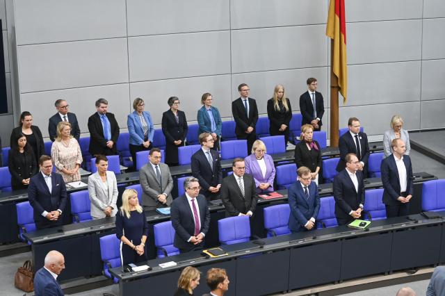 11 July 2025, Berlin: Members of the government and MPs commemorate the 30th anniversary of the Srebrenica genocide in the Bundestag at the start of the debate. Photo: Katharina Kausche/dpa