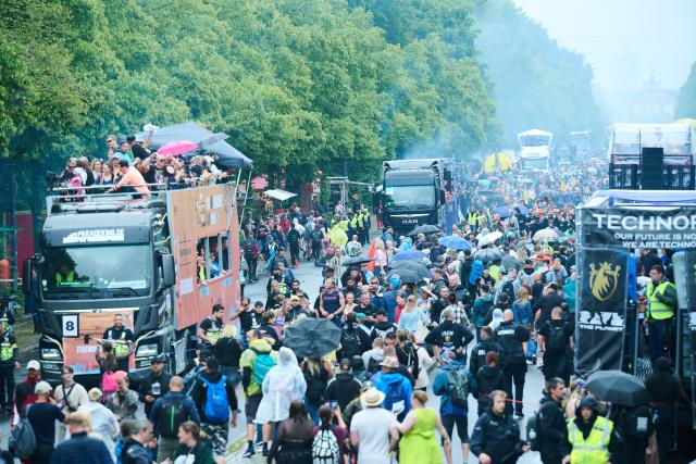 12 July 2025, Berlin: People dance to the music of the techno parade Rave The Planet, which moves along the Strasse des 17. Photo: Annette Riedl/dpa