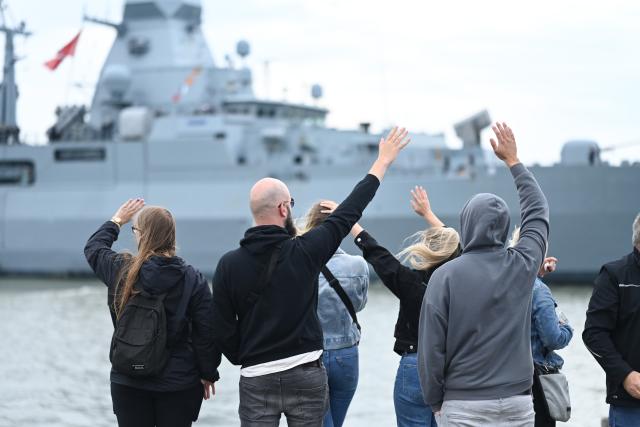 12 July 2025, Lower Saxony, Wilhelmshaven: Members bid farewell to the frigate. The frigate "Hamburg" is to join NATO's maritime task force SNMG1, which consists of several destroyers and frigates and other ships from various NATO member states. This NATO maritime task force has been in existence since 1967. Photo: Lars Penning/dpa