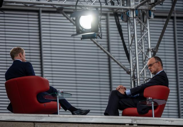 13 July 2025, Berlin: Germany's Chancellor Friedrich Merz (R) sits next to Markus Preiss, head of the ARD Capital Studio, during the ARD summer interview. In the live program *Bericht aus Berlin*, Merz discusses current political issues. Photo: Michael Kappeler/dpa