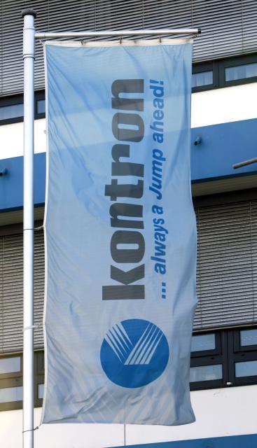 FILED - 13 September 2007, Bavaria, Eching: A flag flies in front of Kontron AG's headquarters in Eching near Munich. Photo: Tobias Hase/dpa