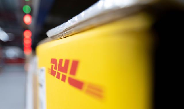 FILED - 22 May 2024, Saxony, Schkeuditz: The logo of DHL is seen on a package in Saxony's DHL Hub. Photo: Hendrik Schmidt/dpa