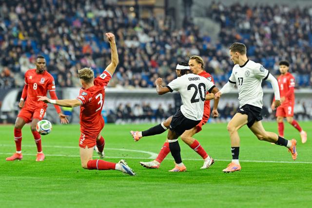 10 October 2025, Baden-Wuerttemberg, Sinsheim: Germany's Serge Gnabry (C) shoots on goal during the FIFA World Cup European Qualifying soccer match between Germany and Luxembourg at the PreZero Arena. Photo: Uwe Anspach/dpa