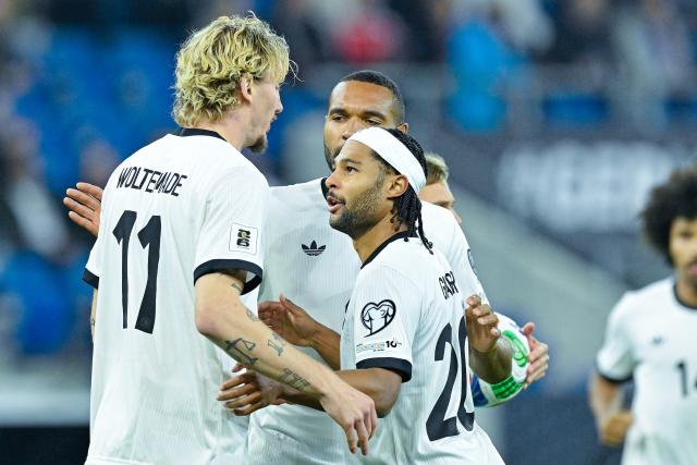 10 October 2025, Baden-Wuerttemberg, Sinsheim: Germany's Nick Woltermade and Serge Gnabry (R) celebrate after the goal attempt during the FIFA World Cup European Qualifying soccer match between Germany and Luxembourg at the PreZero Arena. Photo: Uwe Anspach/dpa