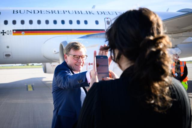 13 October 2025, Brandenburg, Schoenefeld: German Foreign Minister Johann Wadephul has himself filmed by an employee for a social media post at the military section of Berlin Brandenburg Airport shortly before departure to Sofia (Bulgaria) in front of an aircraft of the German Armed Forces Air Wing. Photo: Bernd von Jutrczenka/dpa
