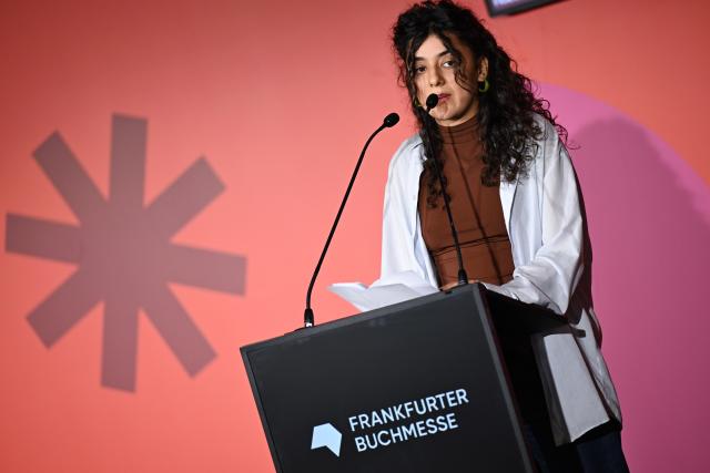 14 October 2025, Hesse, Frankfurt/Main: German author Nora Haddada speaks during the opening press conference of the Frankfurt Book Fair. Photo: Arne Dedert/dpa