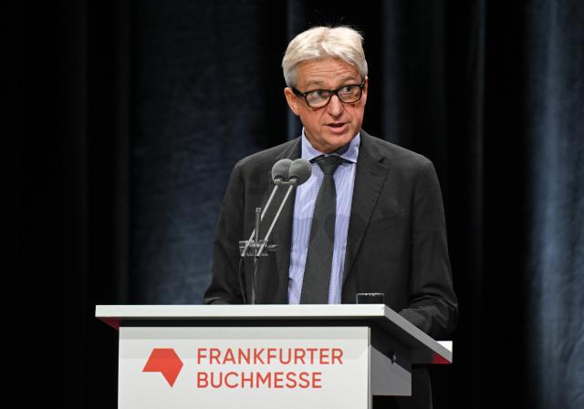 14 October 2025, Hesse, Frankfurt/Main: Director of the Frankfurt Book Fair Juergen Boos speaks at the opening ceremony of the Frankfurt Book Fair. Photo: Arne Dedert/dpa