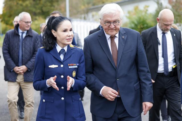 14 October 2025, Rhineland-Palatinate, Andernach: German President Frank-Walter Steinmeier (R) talks with Head of the Bundeswehr Institute of Preventive Medicine Colonel Manuela Andrea Hoffmann on the barracks grounds. Photo: Thomas Banneyer/dpa