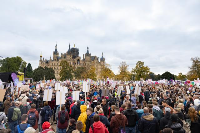 15 October 2025, Mecklenburg-Western Pomerania, Schwerin: Demonstrators hold placards during a protest organized by social organizations under the slogan "Respect instead of red pencil - MV remains social!". The protest event is directed against the state government's austerity plans, in particular against cuts in aid for people with disabilities. Photo: Ulrich Perrey/dpa