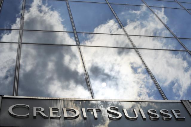 FILED - 14 July 2010, Hesse, Frankfurt_Main: A general view of the Credit Suisse bank logo placed onto the main entrance of the bank's branch in Frankfurt. Photo: Boris Roessler/dpa