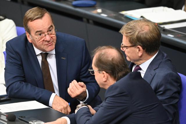 16 October 2025, Berlin: Boris Pistorius (L-R), German Minister of Defense, speaks with Alexander Dobrindt, German Minister of the Interior, and Johann Wadephul, German Minister of Foreign Affairs, during the debate following the government statement on the EU summit in the Bundestag. In addition to the debate following Chancellor Merz's government statement, Parliament is also discussing pension legislation and the Military Service Modernization Act. Photo: Niklas Graeber/dpa