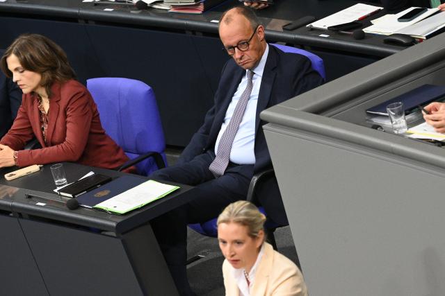 16 October 2025, Berlin: German Chancellor Friedrich Merz (C) listens to a speech by Alice Weidel (R), Federal Chairwoman and leader of the AfD parliamentary group, during the debate following the government statement on the EU summit in the Bundestag. In addition to the debate following Chancellor Merz's government statement, Parliament is also discussing pension legislation and the Military Service Modernization Act. Photo: Niklas Graeber/dpa
