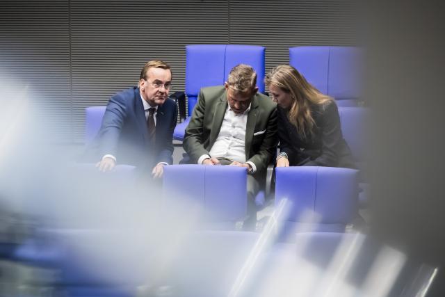 16 October 2025, Berlin: (L-R) Boris Pistorius, German Minister of Defense, Falko Drossmann, defence policy spokesperson for the Social Democratic Party (SPD) parliamentary group and Siemtje Moeller, deputy parliamentary group leader of the SPD parliamentary group, attend the plenary of the German Bundestag following the debate on the Military Service Modernization Act. Photo: Christoph Soeder/dpa