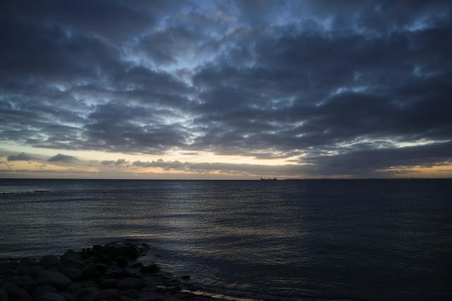 17 October 2025, Schleswig-Holstein, Strande: A ship sails on the Baltic Sea during sunrise. Photo: Frank Molter/dpa