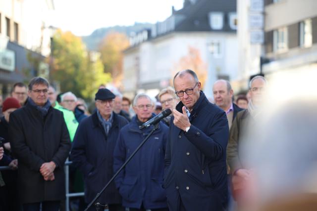 18 October 2025, North Rhine-Westphalia, Meschede: German Chancellor Friedrich Merz speaks to citizens at a public discussion. Merz is from the Sauerland region. Photo: Christoph Reichwein/dpa