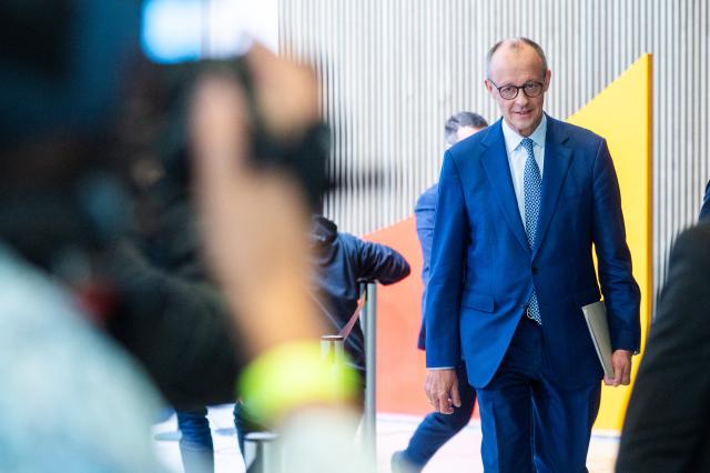 20 October 2025, Berlin: Germany's Chancellor Friedrich Merz leaves the Christian Democratic Union of Germany
(CDD) Presidium after a press conference at the end of the closed meeting. Photo: Christophe Gateau/dpa