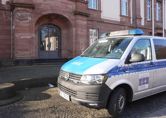 FILED - 06 March 2025, Rhineland-Palatinate, Koblenz: A prisoner transporter stands in front of the Higher Regional Court building. Photo: Thomas Frey/dpa