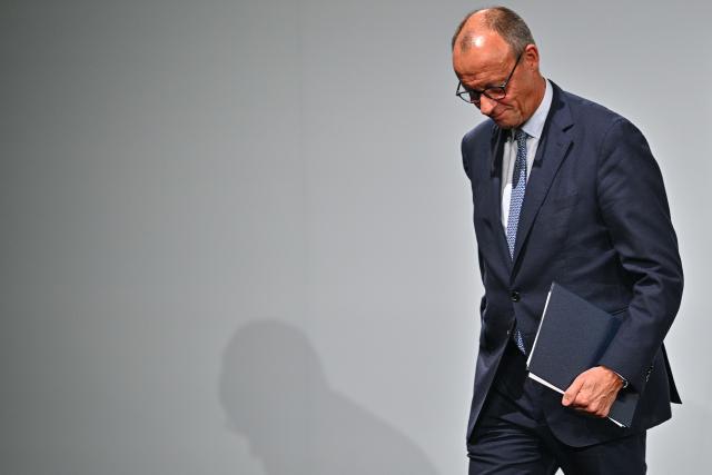 21 October 2025, Baden-Württemberg, Heilbronn: German Chancellor Friedrich Merz walks from the stage at the ground-breaking ceremony for the IPAI Campus during his inaugural visit to the state. Photo: Jan-Philipp Strobel/dpa